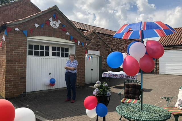Sue Craggs in her red white and blue garden. Picture: Richard Jones. EMN-201105-100537001