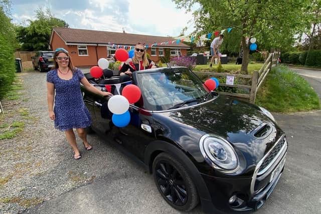 Helen and Caylen Jones and their patriotic Mini. Picture: Richard Jones. EMN-201105-100607001
