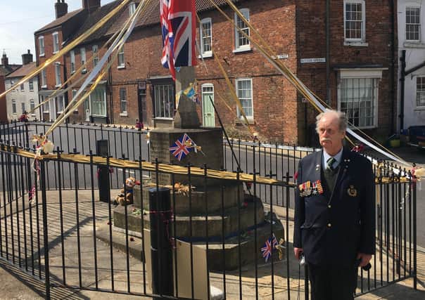 Victor Brocklesby wears his father’s war medals with pride as he is remembered on the 75th anniversary of VE Day at Caistor War Memorial. Picture by Peter Thompson