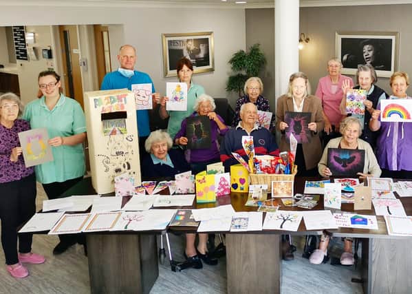 Staff and residents at Holdingham Grange care home thrilled with the cards and pictures from children. EMN-200514-110427001