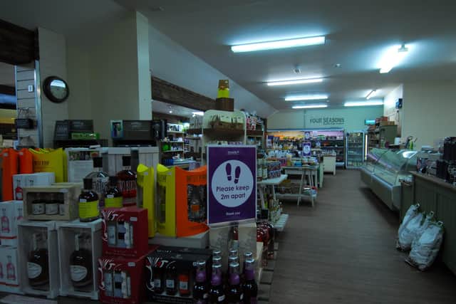 Distancing rules apply for customers around the shop at Four Seasons Garden Centre. EMN-200513-175305001