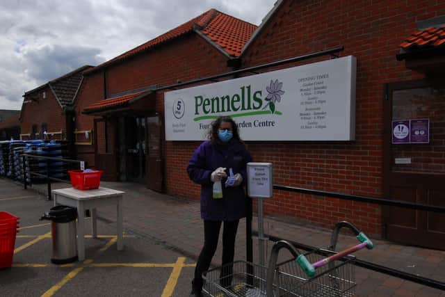 Staff are on hand to manage numbers in the shop and disinfect trollets at Pennells Four Seasons garden centre in Sleaford. EMN-200513-175244001