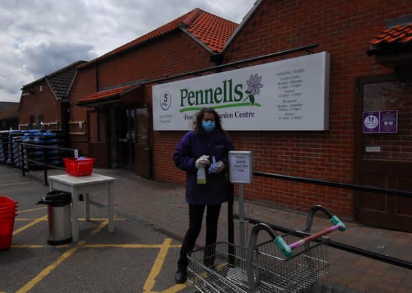 Staff are on hand to manage numbers in the shop and disinfect trollets at Pennells Four Seasons garden centre in Sleaford. EMN-200513-175244001