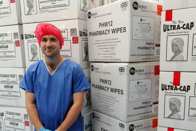 A member of staff from Hyprotect Ltd of Skegness wearing scrubs like the ones the company donated to Pilgrim Hospital.