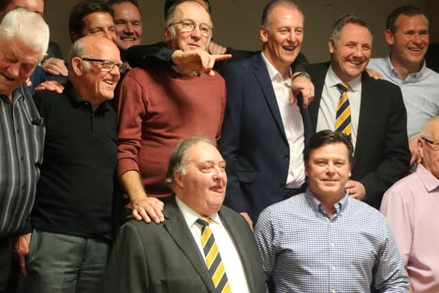 Cook, back row, second right, lines up alongside fellow Pilgrims legends.
