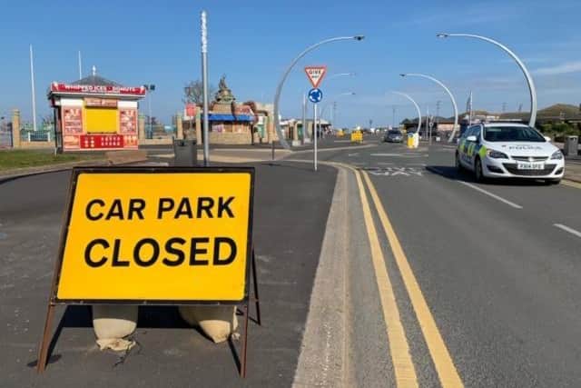 Police were turning cars back from the beach. Photo: John Byford.