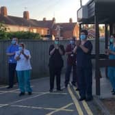 NHS frontline workers saying thank you for their scrubs at the Clap for Carers.