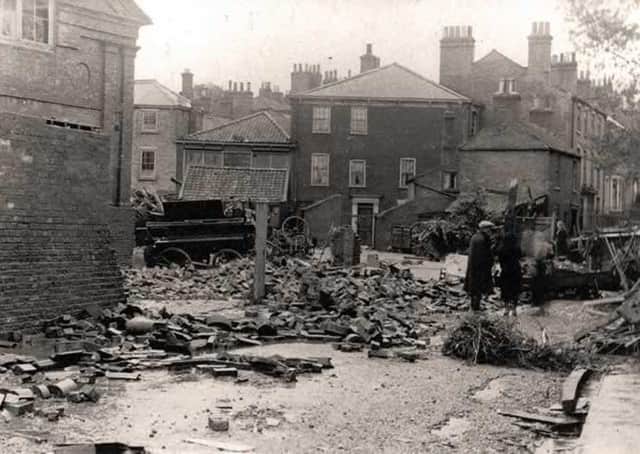 Enginegate (now Broadbank) with the girl’s school in the background on the left. The damaged wall in the foreground (left) was the wall of the fire engine shed. (Photo: Louth Museum)