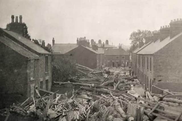 Wellington Street was inundated with tree trunks and logs from the nearby wood yard. (Photo: Louth Museum)