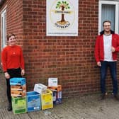 Dominic Solesbury, of the White Hart Hotel, Boston, is pictured handing over the surplus supplies to Centrepoint Outreach’s Kelly Reay.