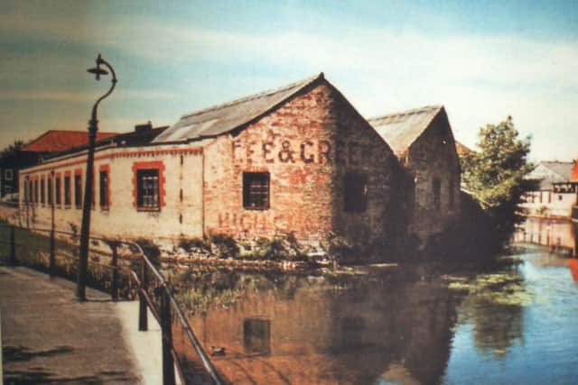 An old colour postcard of the Lea and Green factory viewed from Eastbanks towards Carre Street. EMN-200106-120845001
