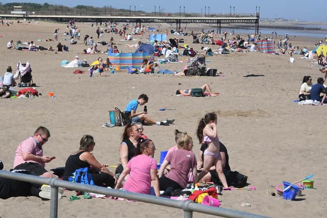 Families enjoying the beach in Skegness on Bank Holiday Monday.