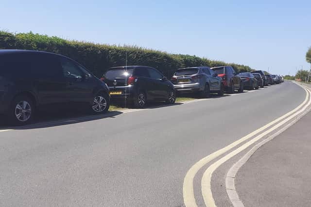 Cars stretched back to Roman Bank from Anderby Creek village.