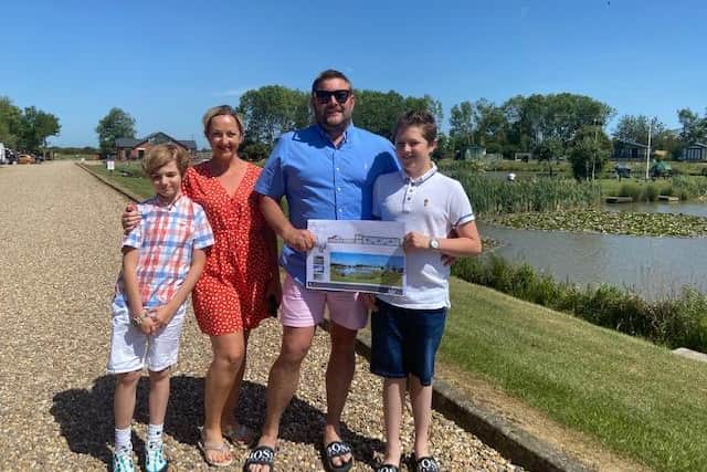 Jo and Ashley Boxall with sons Oscar (holding plans) and Alexander.