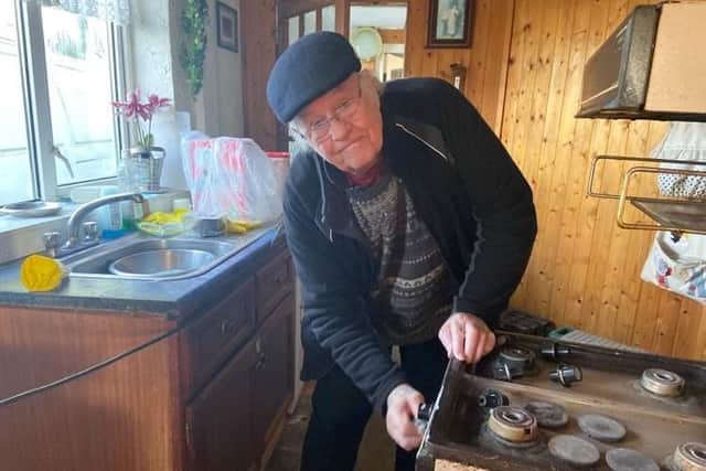 Derek cleaning an old cooker at Christmas.