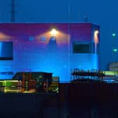 The barrier was lit up in blue recently in tribute to key workers - including those working on its construction