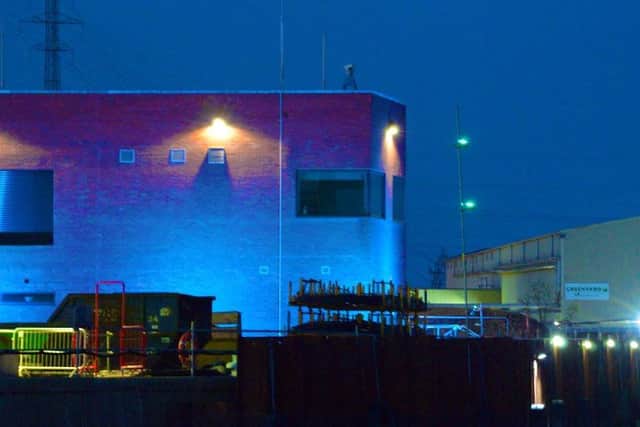 The barrier was lit up in blue recently in tribute to key workers - including those working on its construction