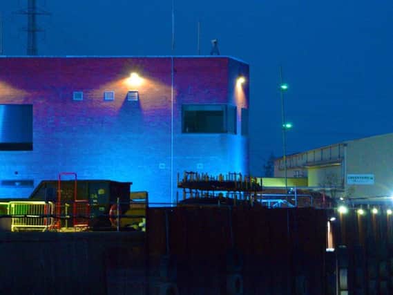 The barrier was lit up in blue recently in tribute to key workers - including those working on its construction