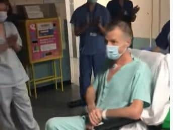 George is applauded by a guard of honour as he leaves intensive care