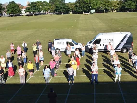 Skegness Sewers for the NHS gathered for a presentation of 1,000 to  make scrubs. Photo: Barry Robinson.