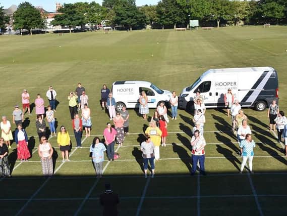 Skegness Sewers for the NHS gathered for a presentation of 1,000 to make scrubs. Photo: Barry Robinson.