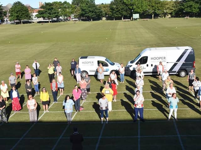 Skegness Sewers for the NHS gathered for a presentation of 1,000 to  make scrubs. Photo: Barry Robinson.