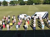 Skegness Sewers for the NHS gathered for a presentation of 1,000 to  make scrubs. Photo: Barry Robinson.
