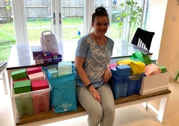 Midwifery student Kayleigh Sherwin of Greylees with some of the sanitary packages she has collected for Action Aid. EMN-200806-155917001