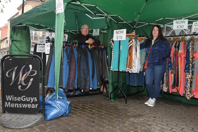Sleaford market re-opens after lock-down. Mike Willis - owner of Wiseguys and his daughter Samantha John - owner of Wisegirls. EMN-200806-093940001