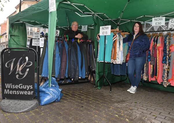 Sleaford market re-opens after lock-down. Mike Willis - owner of Wiseguys and his daughter Samantha John - owner of Wisegirls. EMN-200806-093940001