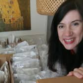 Tracey Sherwood preparing some activity packs for distribution.