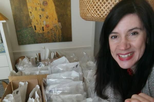 Tracey Sherwood preparing some activity packs for distribution.