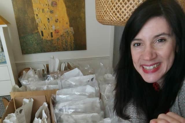 Tracey Sherwood preparing some activity packs for distribution.