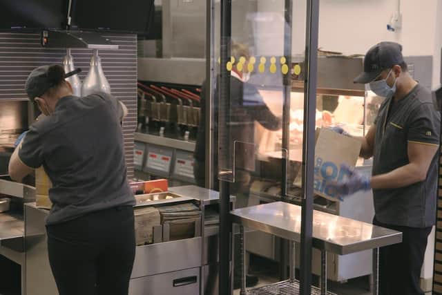 McDonald's staff will be working behind screens as part of safe social distancing in kitchens. EMN-200406-162513001
