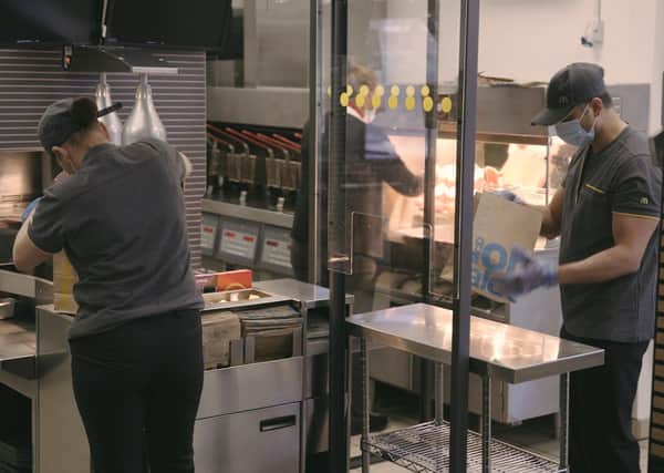 McDonald's staff will be working behind screens as part of safe social distancing in kitchens. EMN-200406-162513001