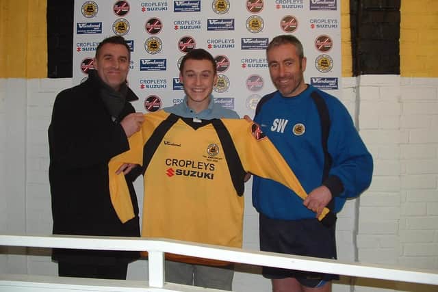 Miller joins United the first time. Pictured with management duo Andrew Stanhope and Steve Welsh.