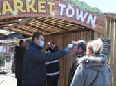 Visitors have their temperatures taken before being allowed on site.