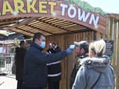 Visitors have their temperatures taken before being allowed on site.