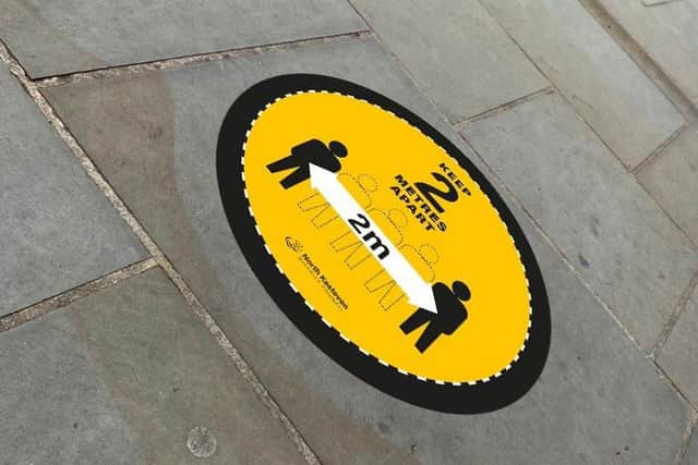 NKDC's new pavement stickers promoting safer shopping in Sleaford. EMN-200806-164556001