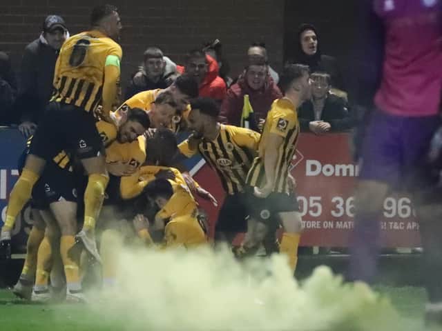 United celebrate scoring in their final FA Cup clash at York Street, a 2-1 defeat to Rochdale. Photo: Eric Brown