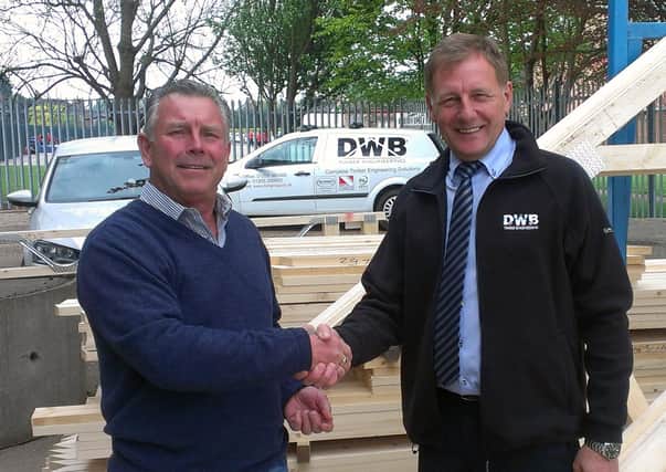 Mick Vines and DWB's Steve Pinner shake on the original deal in 2014.
