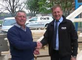 Mick Vines and DWB's Steve Pinner shake on the original deal in 2014.