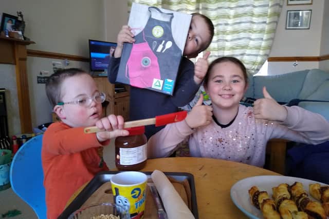 Presenting a cooking video, award-winner Zoe Miller with brothers Alex and Coen.