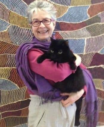 Author Ruth Taylor and her cat, Blackie.