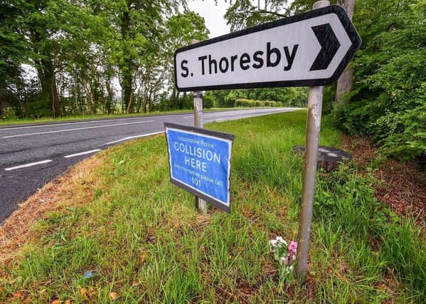 Flowers were left near the police collision sign, on the A16 at Calceby. EMN-201006-155035001