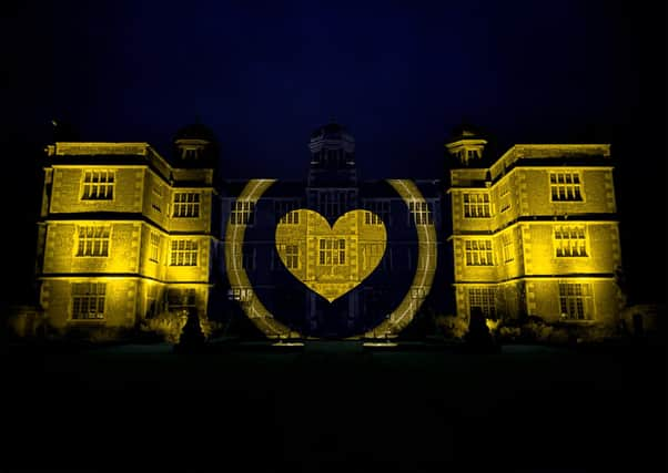 Doddington Hall in Lincoln lit up yellow to celebrate. EMN-201106-094034001