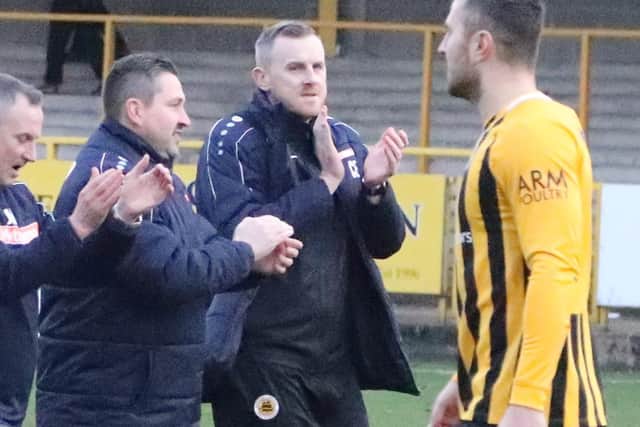 Craig Elliott with assistant John McDermott and goalkeeping coach Rich Lawrence. Photo: Eric Brown.