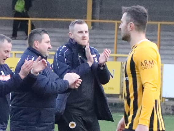 Craig Elliott with assistant John McDermott and goalkeeping coach Rich Lawrence. Photo: Eric Brown.