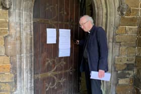 The Rev Charles Patrick opens the main door at St Mary's.