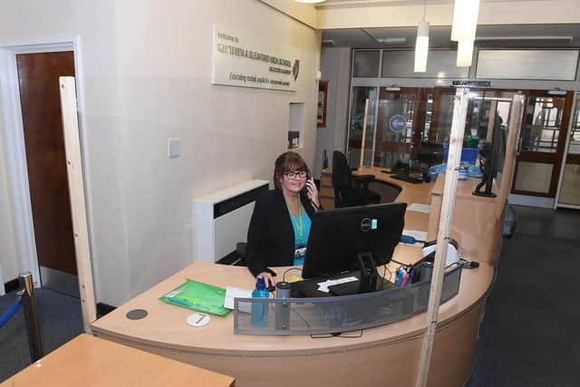 Sleaford and Kesteven High School re-opens for some pupils. Receptionist Linda Harbin working behind a screen. EMN-200615-161553001